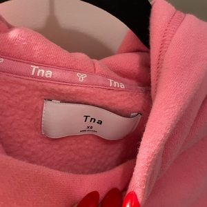 Aritzia TNA hot pink cropped hoodie